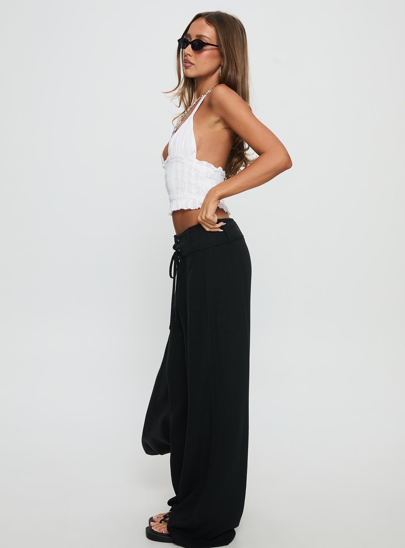 side view of model wearing Princess Polly Raymonde Pants Black High Waisted Pants 