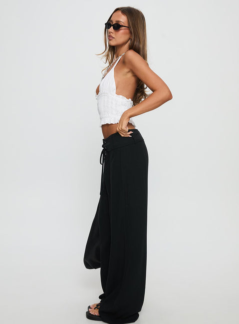 side view of model wearing Princess Polly Raymonde Pants Black High Waisted Pants 