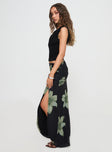   side view of model wearing Princess Polly Cooperi Maxi Skirt Black Floral Maxi 