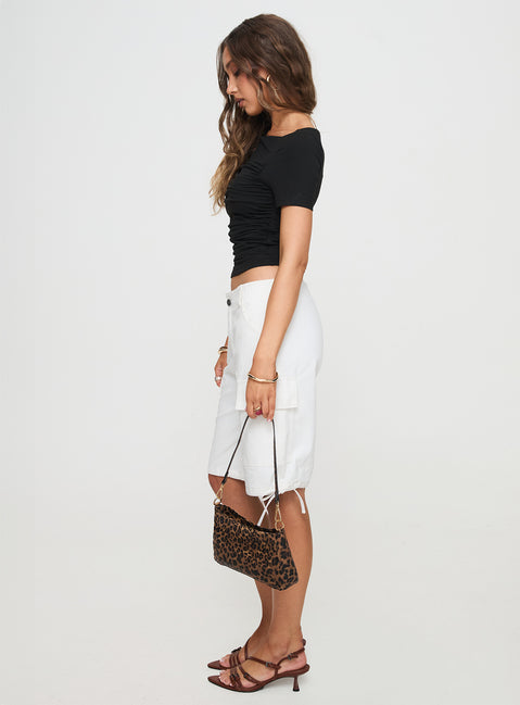 side view of model wearing Princess Polly Bleachers Shorts White High Waisted Shorts 