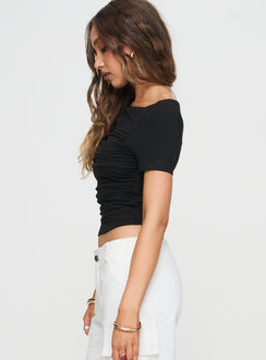 side view of model wearing Princess Polly Peyson Top Black Short Sleeves Scoop Neck 