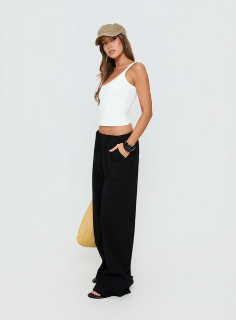 side view of model wearing Princess Polly Lunea Concealed Waistband Pants Black Low Rise Pants 