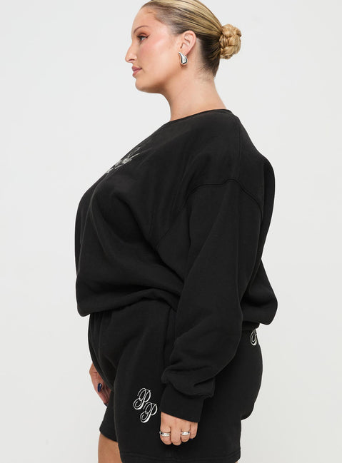 side view of model wearing Princess Polly Princess Polly Crew Neck Sweatshirt Cursive Text Black Sand Curve 