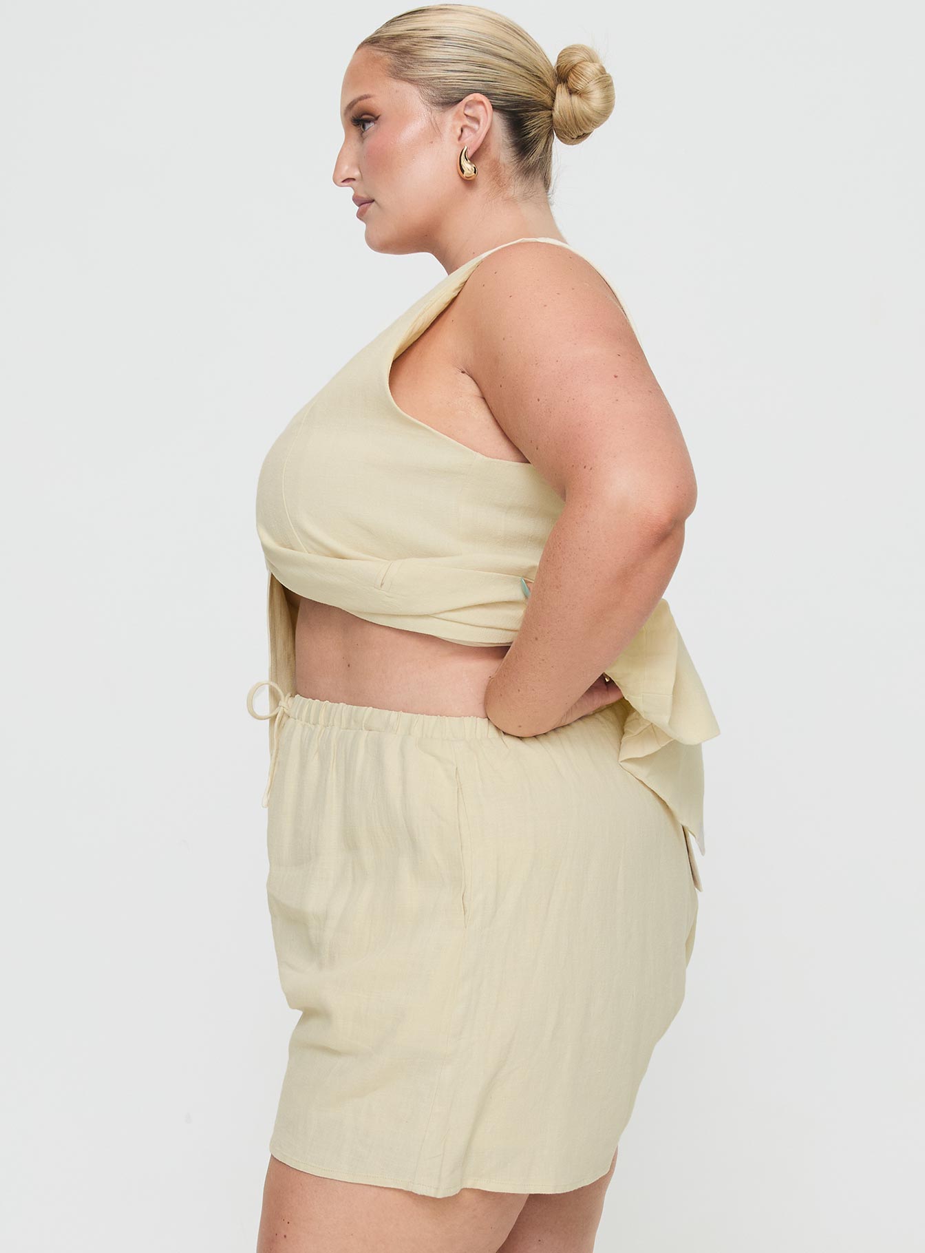 side view of model wearing Princess Polly This Summer Linen Blend Shorts Sand Curve High Waisted Shorts 