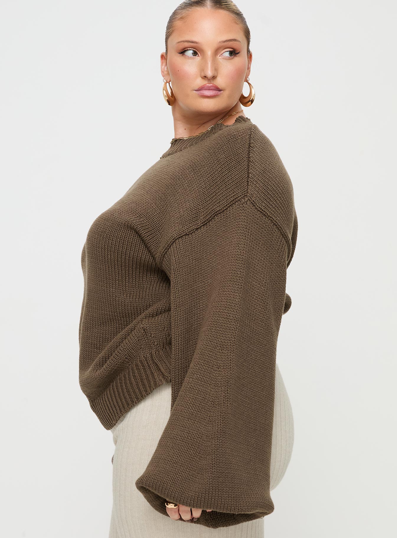 side view of model wearing Princess Polly Harmony Knit Sweater Dark Brown Curve 
