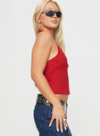 side view of model wearing Princess Polly Stand By Halter Top Red Sleeveless Plunger 