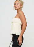 side view of model wearing Princess Polly Avelina Strapless Top Cream Sleeveless straight 