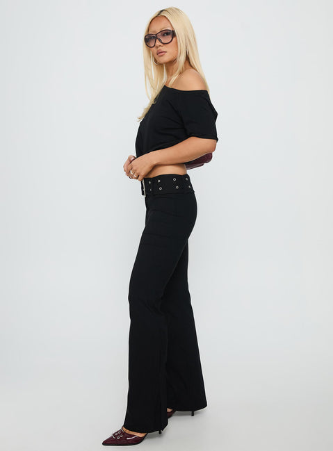 side view of model wearing Princess Polly Kortnee Eyelet Detail Flare Leg Pants Black Low Rise Pants 