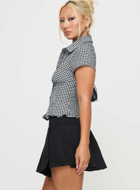   side view of model wearing Princess Polly Anubis Pleat Mini Skirt Black Mini Skirts 