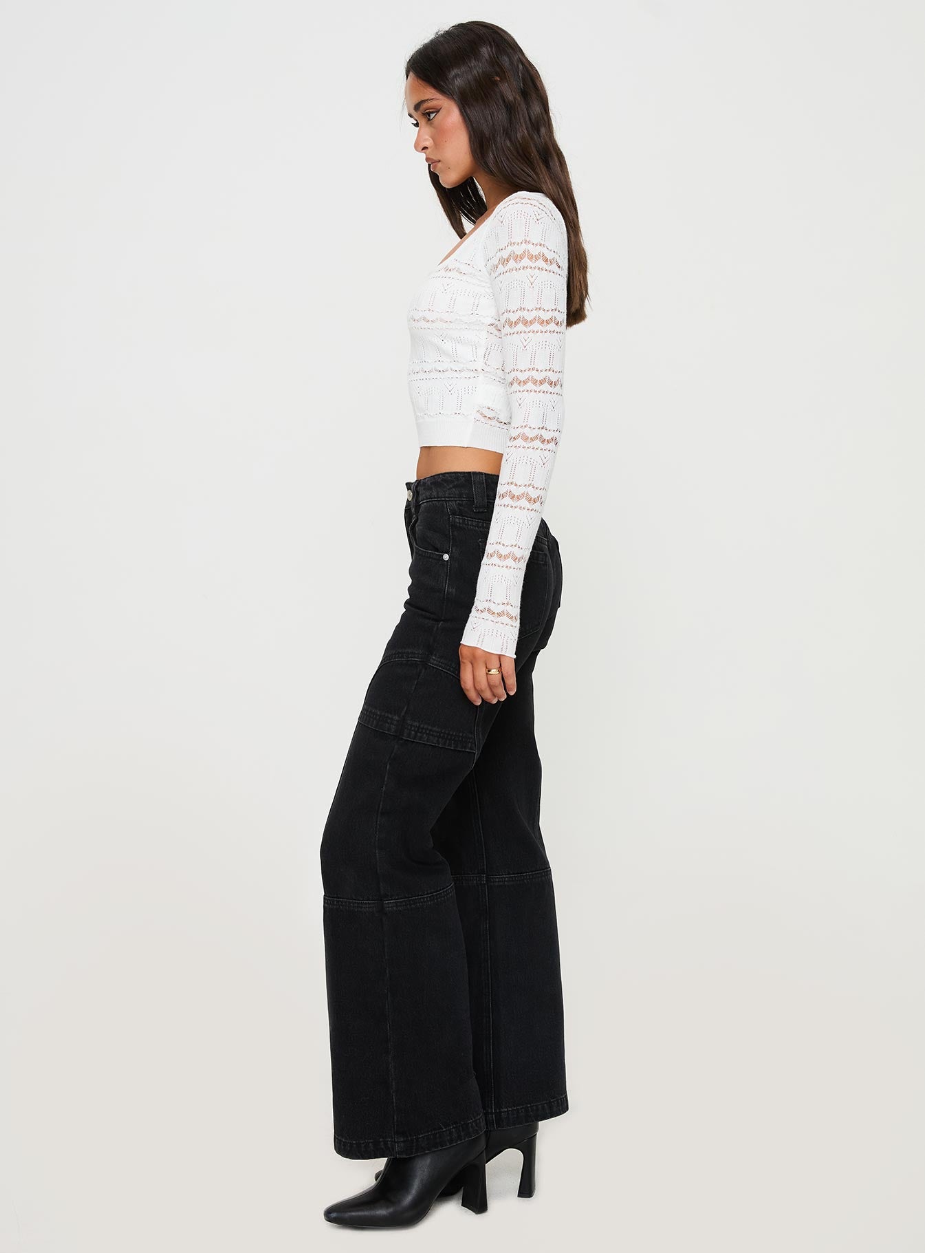 side view of model wearing Princess Polly Adims Jeans Washed Black Mid Rise 