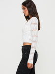 side view of model wearing Princess Polly Valor Long Sleeve Knit Top White Full Sleeves Square Neck 