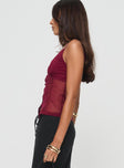 side view of model wearing Princess Polly Singers Top Red Sleeveless V-Neck 