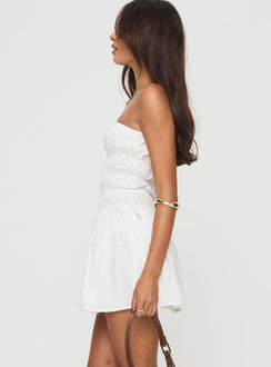 side view of model wearing Princess Polly Mercier Strapless Mini Dress White Straight Neck 