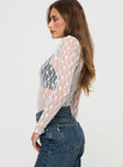 side view of model wearing Princess Polly Liedman Long Sleeve Bodysuit White Full Sleeves 