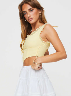 side view of model wearing Princess Polly Scarlett Top Yellow Sleeveless Sweetheart 