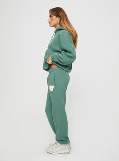 side view of model wearing Princess Polly Princess Polly Track Pants Bubble Text Sage / Eggshell Mid Rise 
