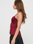 side view of model wearing Princess Polly Gunnar Top Burgundy Sleeveless Plunger 