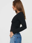 side view of model wearing Princess Polly Aeva Long Sleeve Plunge Top Black Full Sleeves Plunger 