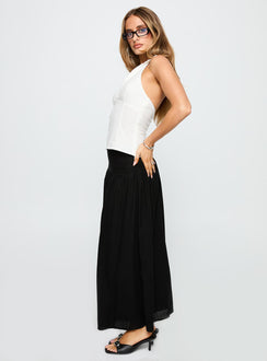   side view of model wearing Princess Polly Human Nurture Maxi Skirt Black Maxi 