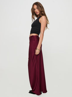   side view of model wearing Princess Polly Fluttering Maxi Skirt Burgundy Maxi 