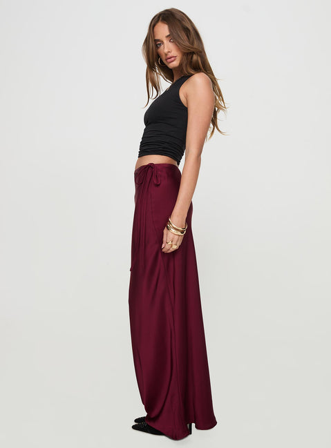   side view of model wearing Princess Polly Fluttering Maxi Skirt Burgundy Maxi 