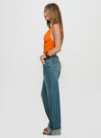 side view of model wearing Princess Polly Toros Mid Rise Denim Jeans Mid Blue Mid Rise 