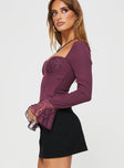 Long sleeve top Lace detail, elasticated shoulders, invisible zip fastening at side, flared sleeve Non-stretch material, lined bust