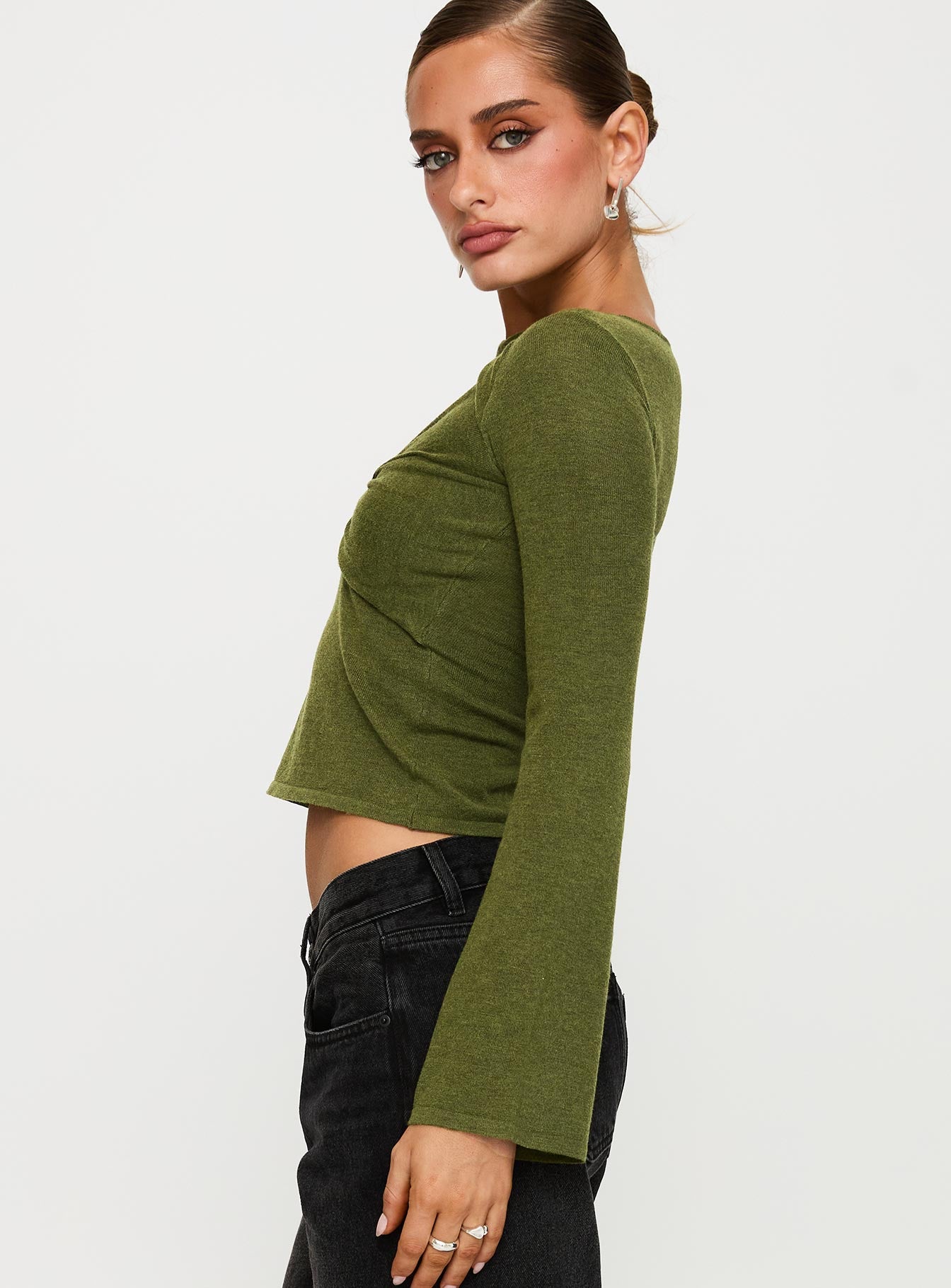 side view of model wearing Princess Polly Giordani Long Sleeve Twist Top Moss Green Full Sleeves Crew Neck 