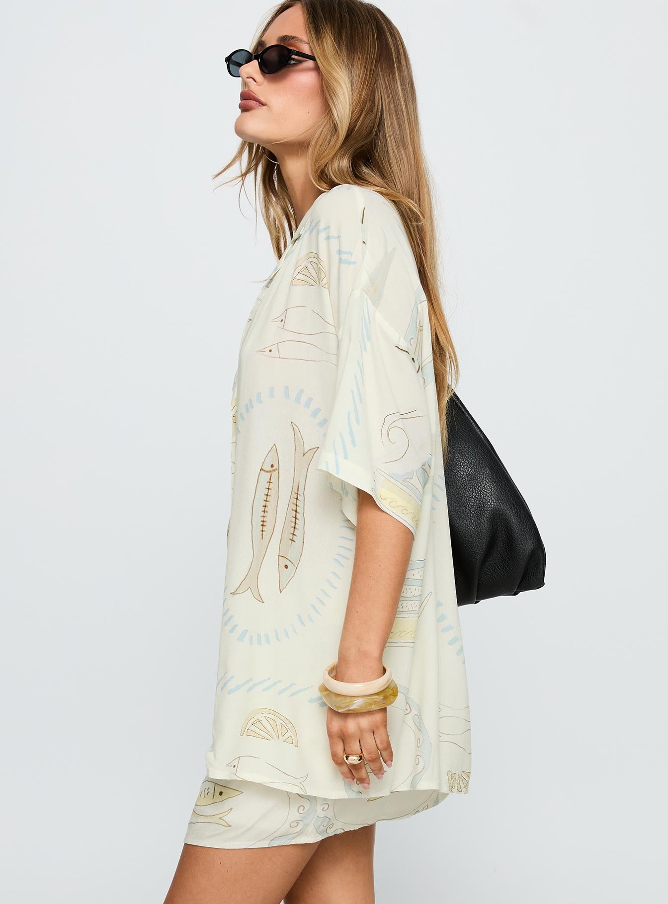 side view of model wearing Princess Polly Caraliia Shirt Cream Half Sleeves V-Neck 