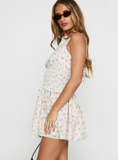 side view of model wearing Princess Polly Yennifer Shirred Mini Dress Floral Multi High Neck 