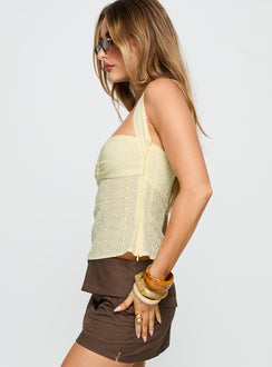 side view of model wearing Princess Polly Isabetta Halter Top Lemon Sleeveless Sweetheart 