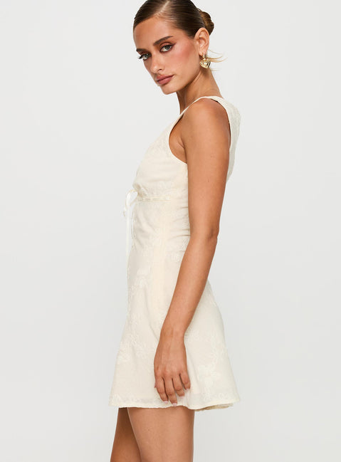 side view of model wearing Princess Polly Faithfully Embroidered Mini Dress Beige Plunger 