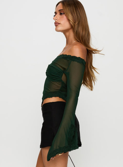 side view of model wearing Princess Polly Empty Space Top Forest Green Full Sleeves Asymmetric Neckline 