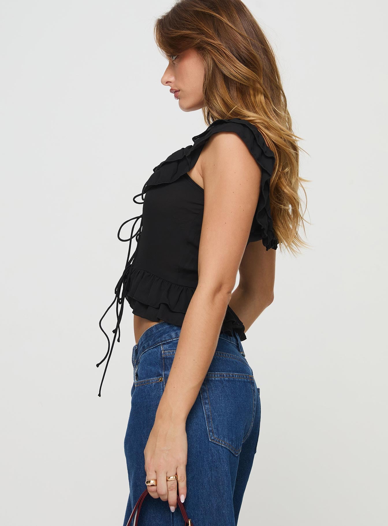 side view of model wearing Princess Polly Redwood Top Black Short Sleeves Sweetheart 