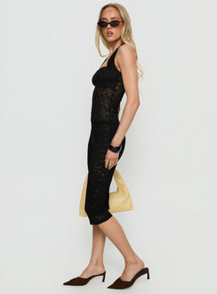 side view of model wearing Princess Polly Babydoll Capri Pants Noir Mid Rise Pants 