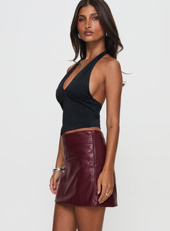   side view of model wearing Princess Polly Kalilah Faux Leather Mini Skirt Red Mini Skirts 