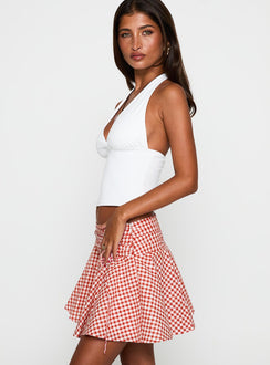   side view of model wearing Princess Polly Sweet Verona Ruched Mini Skirt Red Check Mini Skirts 