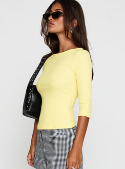 side view of model wearing Princess Polly Elaia 3/4 Sleeve Top Yellow Three Fourth Sleeves Crew Neck 