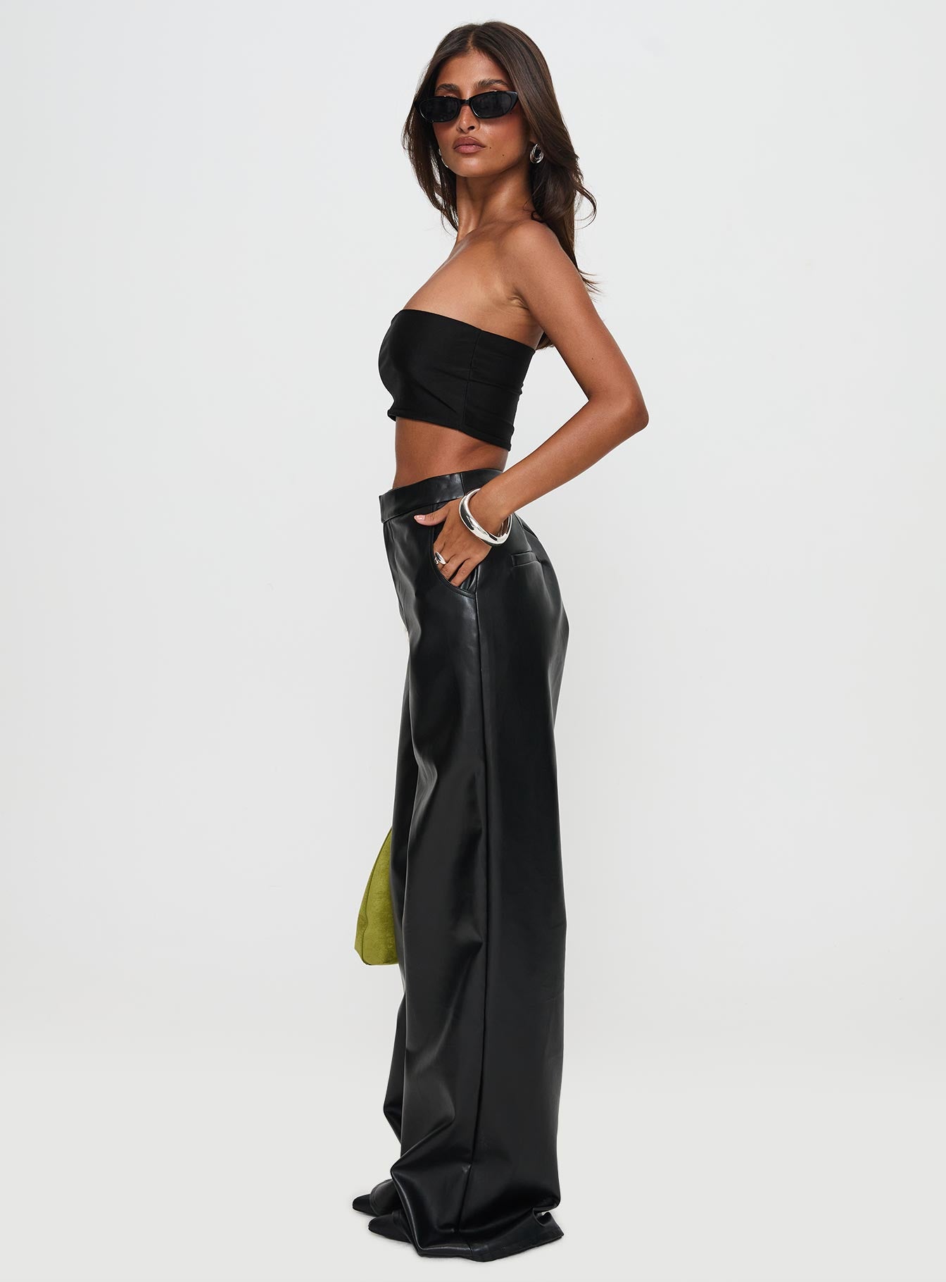 side view of model wearing Princess Polly Tempted Faux Leather Pant Black High Waisted Pants 