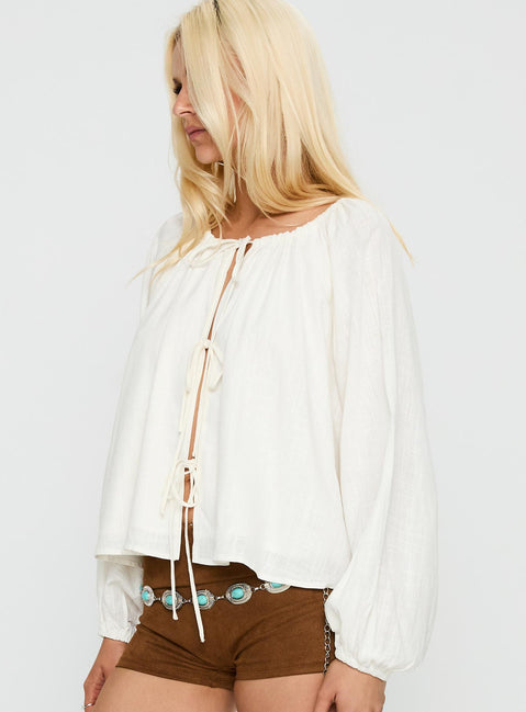 side view of model wearing Princess Polly Somebody Else Tie Up Top White Full Sleeves Crew Neck 