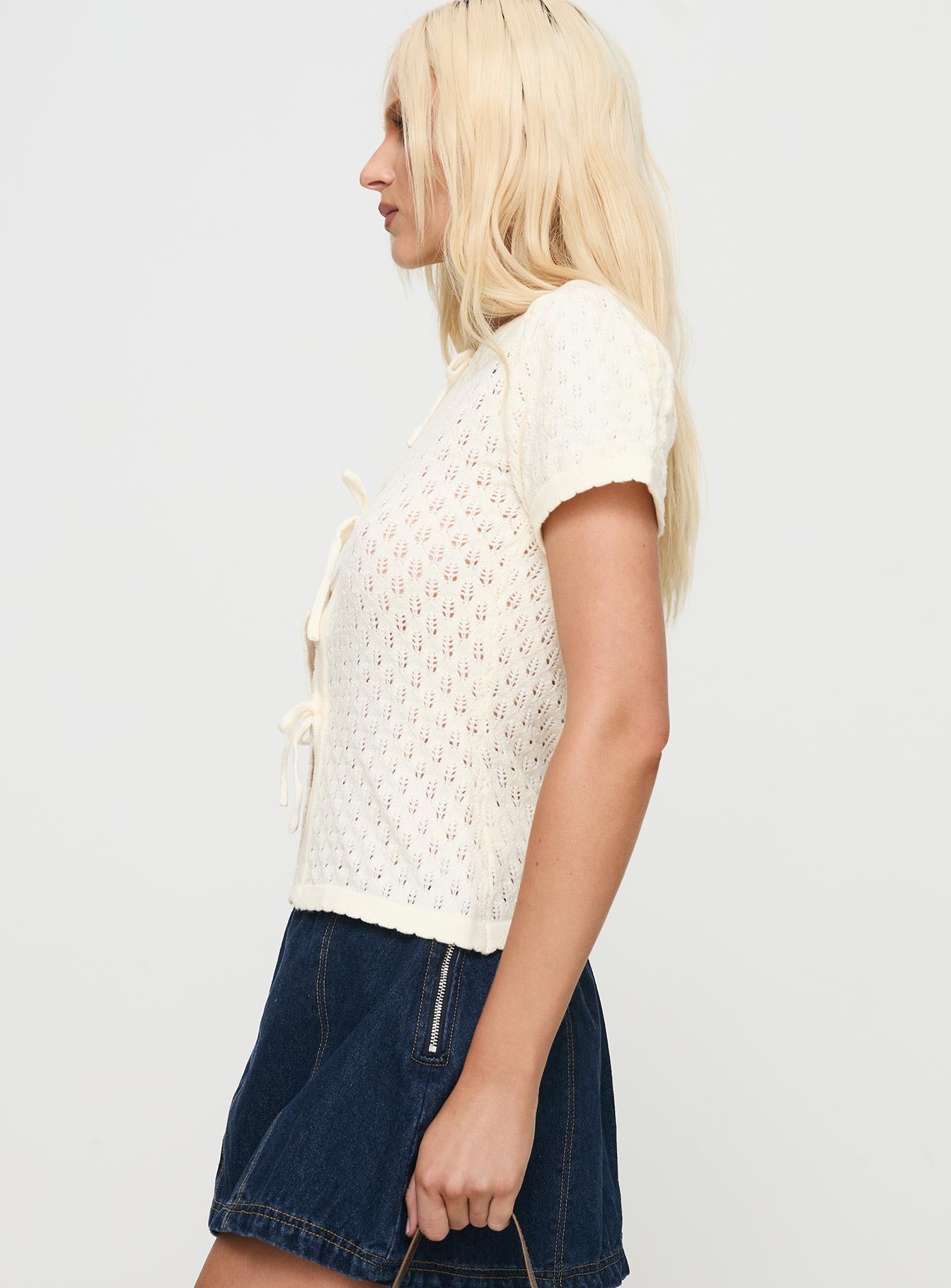 side view of model wearing Princess Polly Mari Knit Top Cream Short Sleeves Crew Neck 