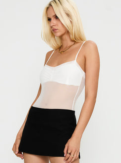 side view of model wearing Princess Polly In The Club Bodysuit White Sleeveless 