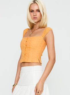 side view of model wearing Princess Polly Lyncher Top Orange Short Sleeves Square Neck 