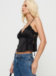 side view of model wearing Princess Polly Isolind Top Black Sleeveless V-Neck 