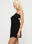 side view of model wearing Princess Polly Granno Mini Dress Black Sweetheart Neckline 