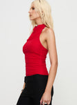 side view of model wearing Princess Polly Dafina Halter Top Red Sleeveless Cowl 