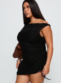 side view of model wearing Princess Polly Bella Luna Ruched Mini Dress Black Curve Asymmetric Neckline 
