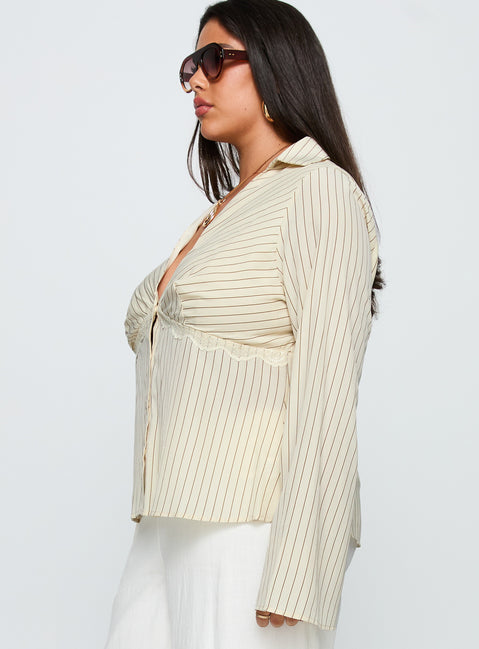 side view of model wearing Princess Polly Life Begins Long Sleeve Lace Trim Top Cream Stripe Curve Full Sleeves Plunger 