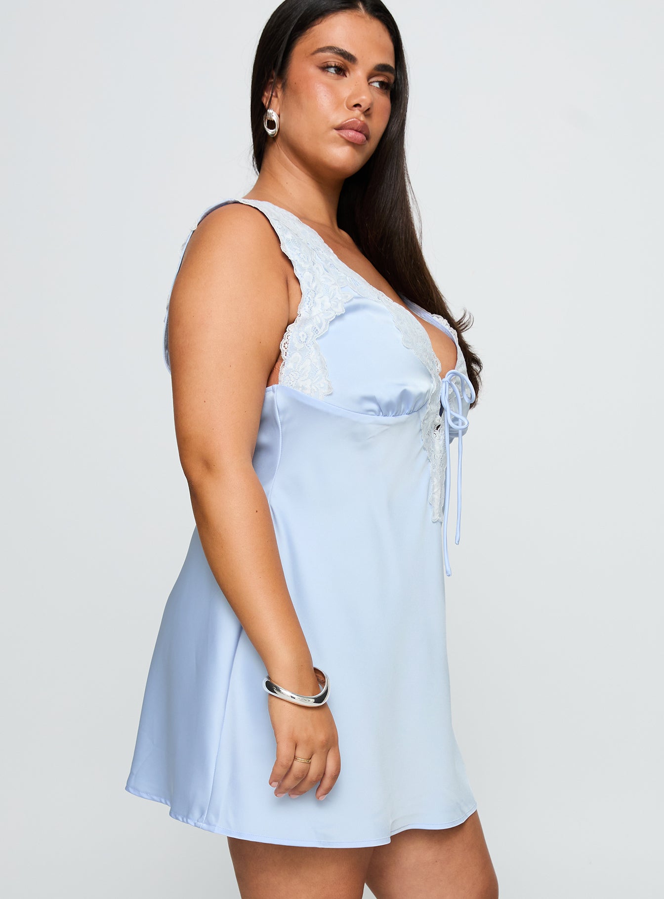 side view of model wearing Princess Polly Nourish Mini Dress Blue Curve Plunger 