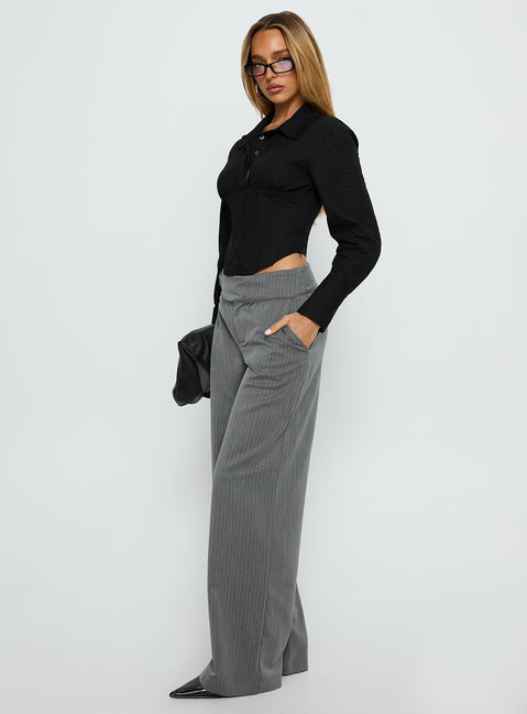 side view of model wearing Princess Polly Jinny Relaxed Buckle Tailored Pants Grey Pinstripe Low Rise Pants 